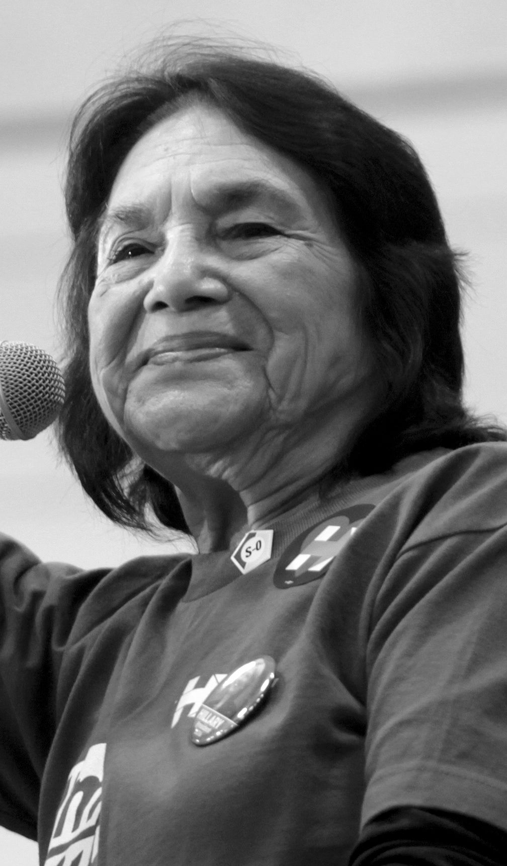 Portrait-oriented photograph of Dolores Huerta speaking in 2016