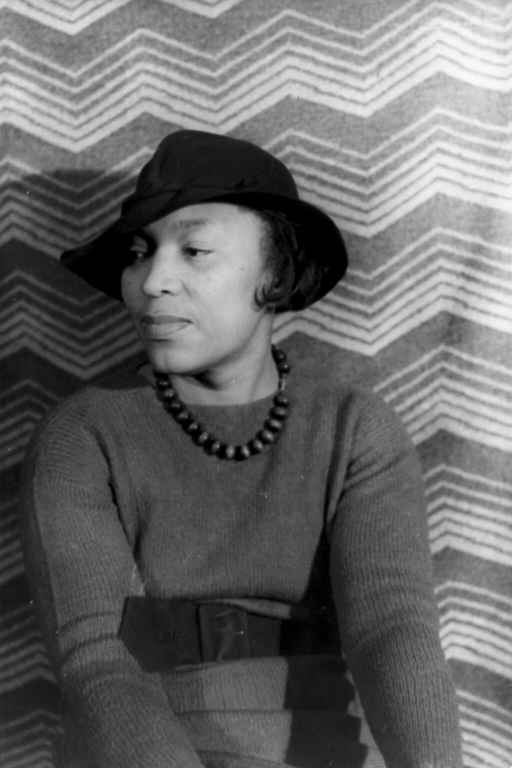 Clear, portrait-oriented monochrome photograph of Zora Neale Hurston in 1938